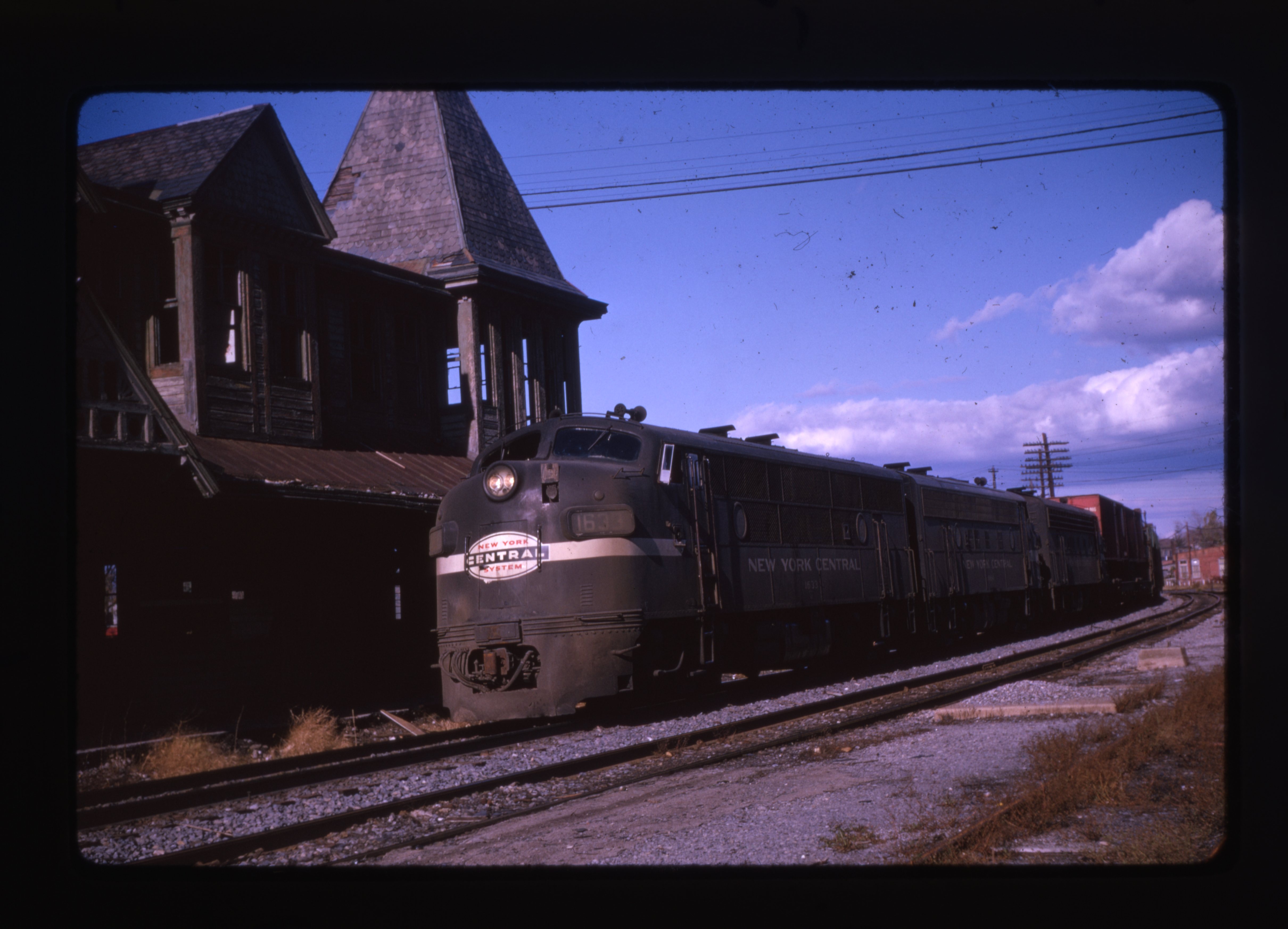 New York Central trains pass by the old Kingston Station prior to demolition.