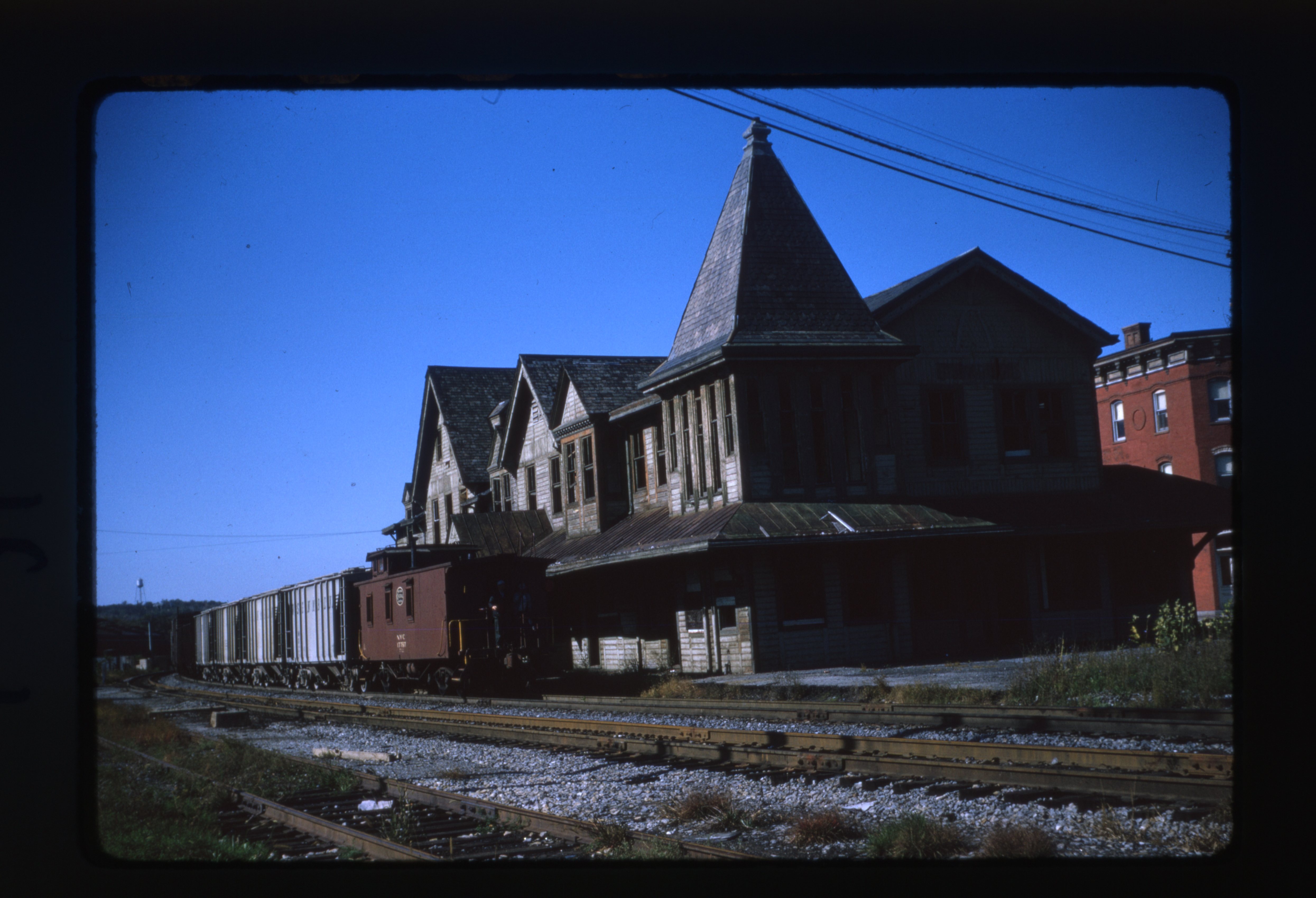 New York Central trains pass by the old Kingston Station prior to demolition.