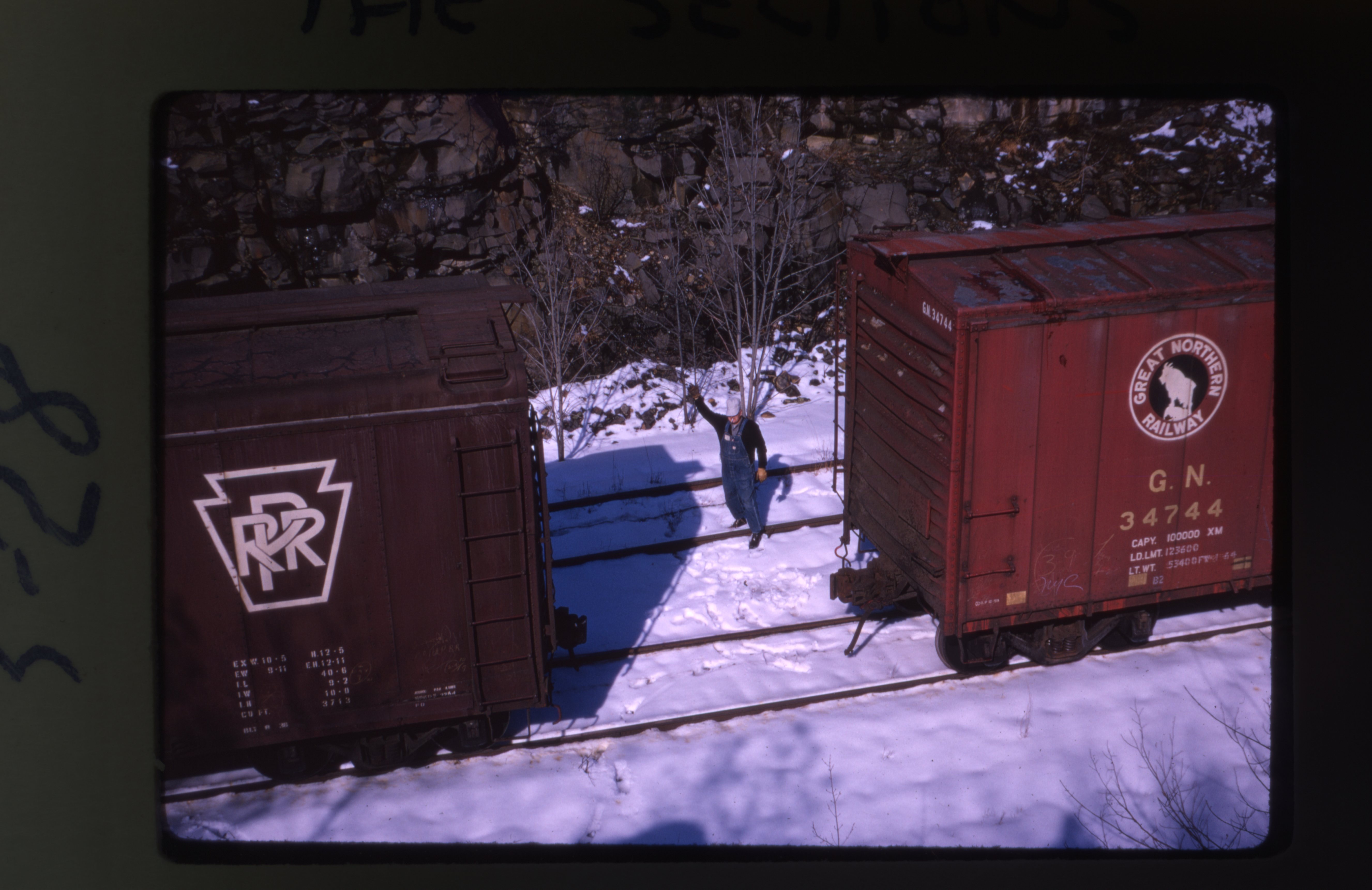 A brakeman reconnects a train at West Hurley on the Ulster and Delaware Railroad ca. 1962